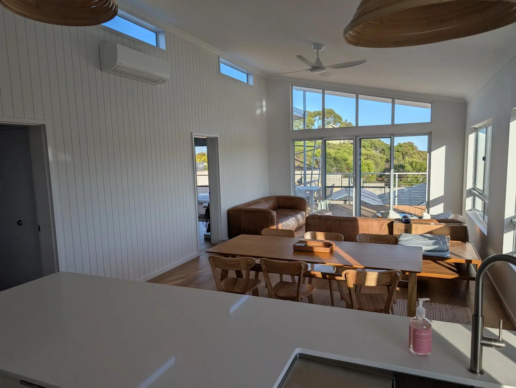 Light-filled living and dining area inside the completed Capsule Builders home in Binningup